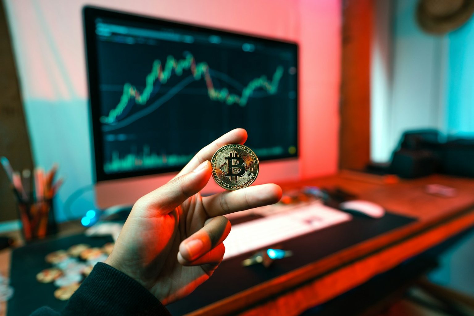 No Slippage, More Control: How OTC Desks Support High-Volume Crypto Trades a person holding a coin in front of a computer; OTC crypto trading